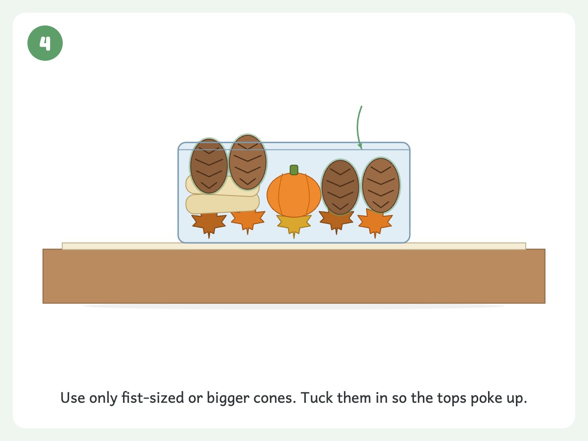 Step 4: Tuck in three to five fist-sized or larger pinecones so they poke out